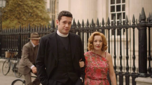 Tom Brittney as Will Davenport and Kacey Ainsworth as Cathy Keating strolling down the street together in Grantchester Season 8